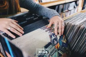 When you support small businesses in Effingham, Chatham, and Bryan counties, you may stumble upon little treasures that you wouldn’t find elsewhere. In this image, a woman looks through a crate of records.