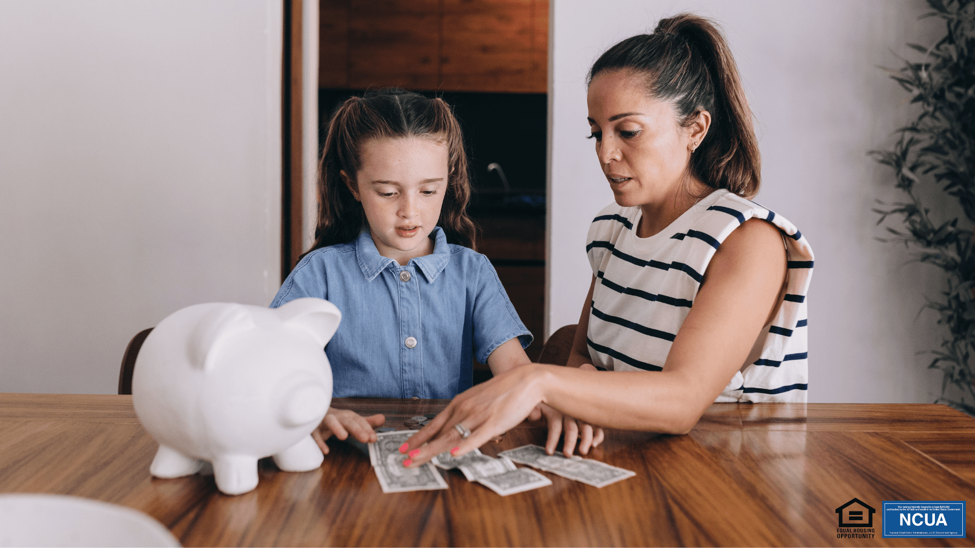 Woman and child saving money using the Kidz Club program