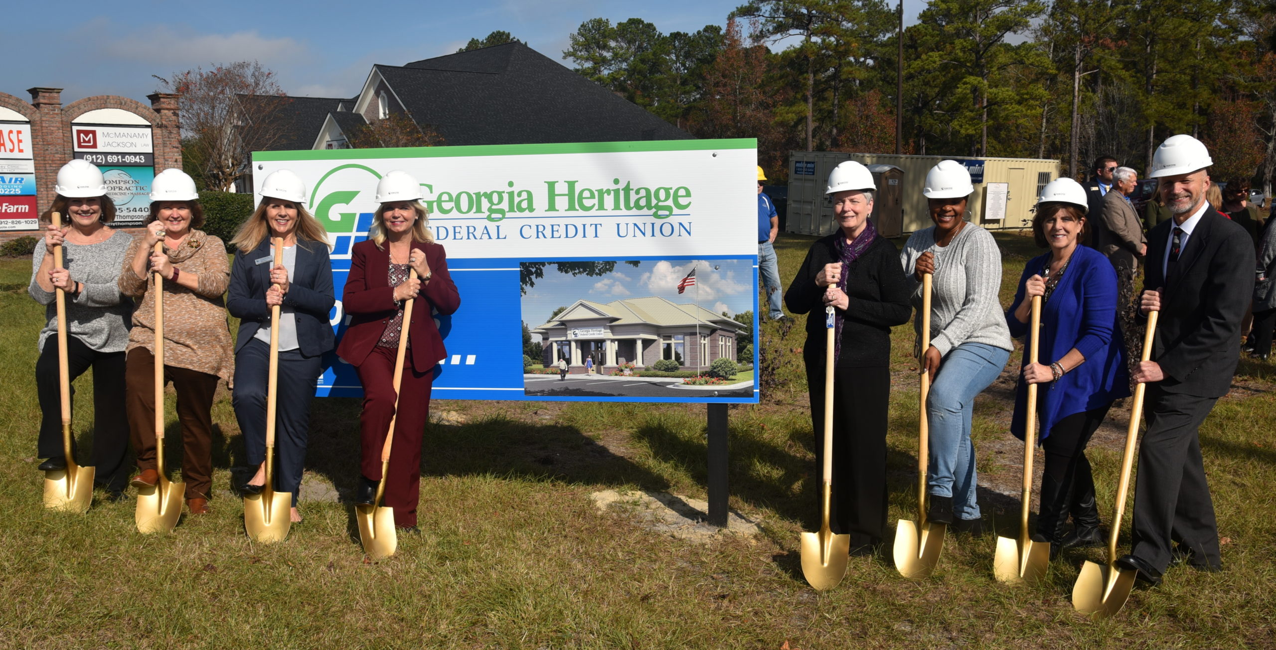 Susan Helmey (left), Donna Trapani, Billie Dees, Toni Brantley, Brenda Elmgren, Karen Bogans, Becky Orsi and Dale Taratuta participate in the groundbreaking ceremony for the opening of the Georgia Heritage Federal Credit Union branch in Rincon, Georgia.
