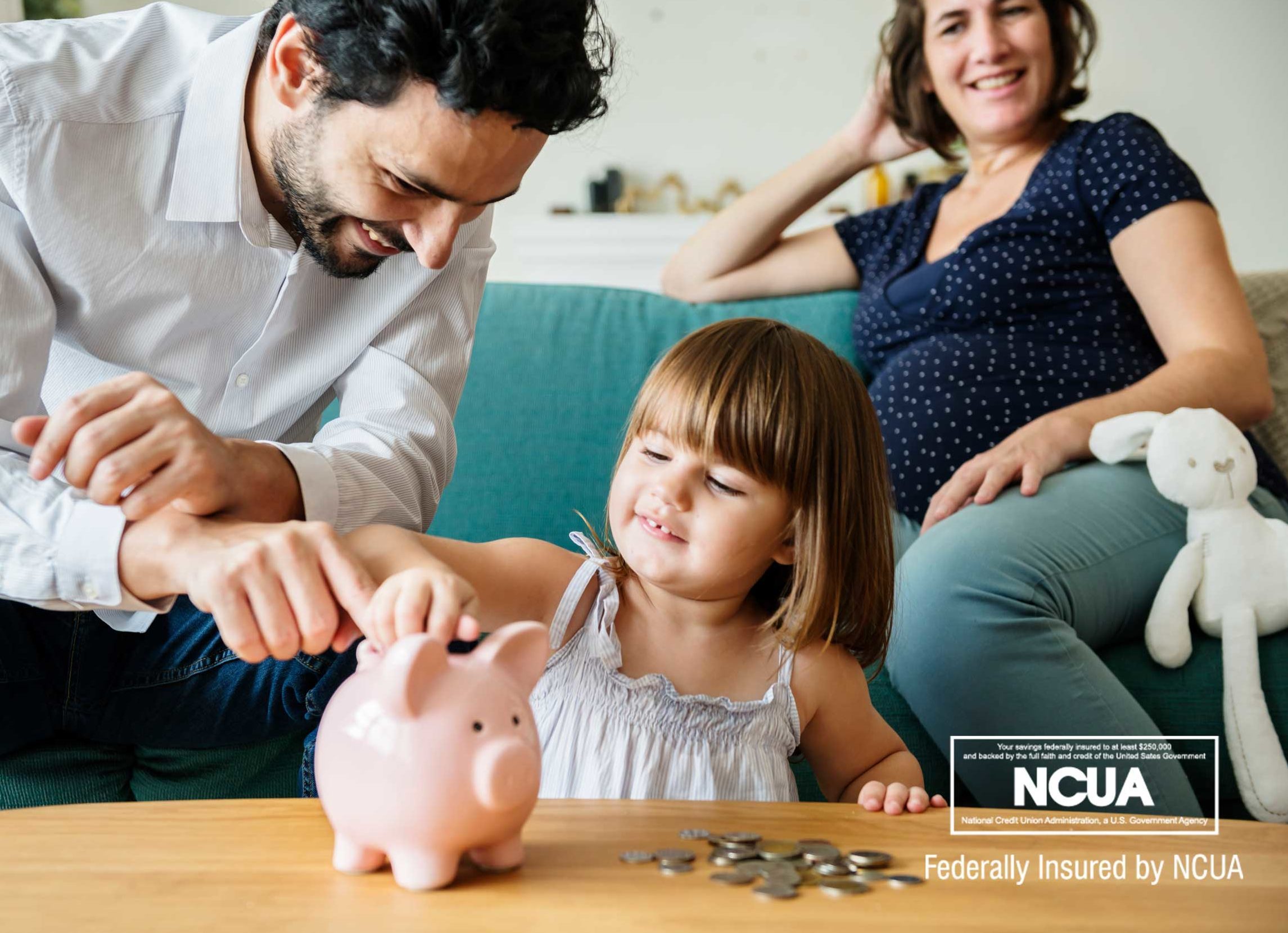 Teaching financial literacy to children is one way to motivate them to save money. The child in this picture looks happy to be dropping money into her piggy bank.