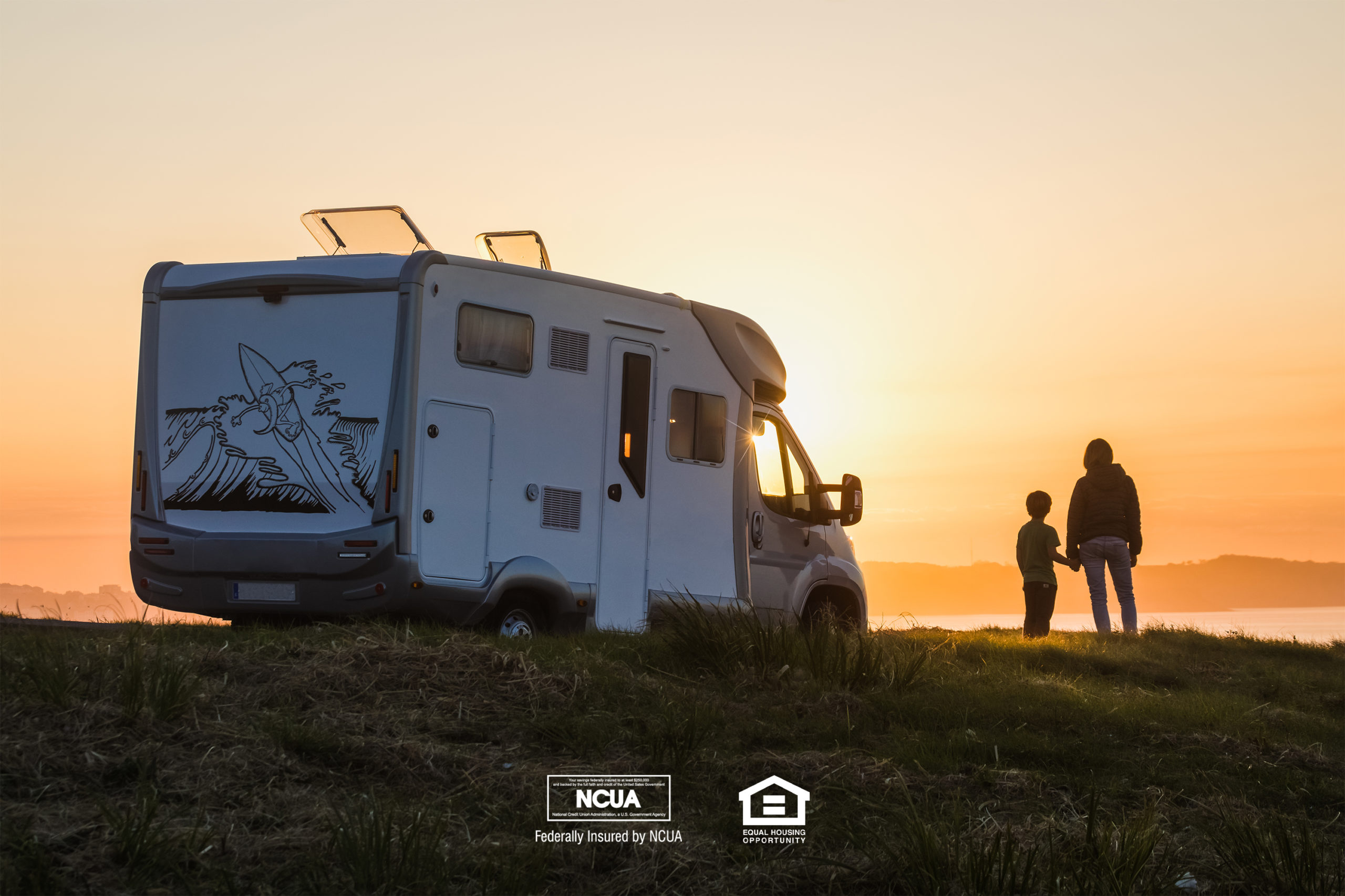 If you are looking for consumer loans in Georgia, we may be able to offer options for personal loans, recreational vehicle loans, boat loans, and more. In this image, a parent and child watch a sunset with an RV parked beside them.