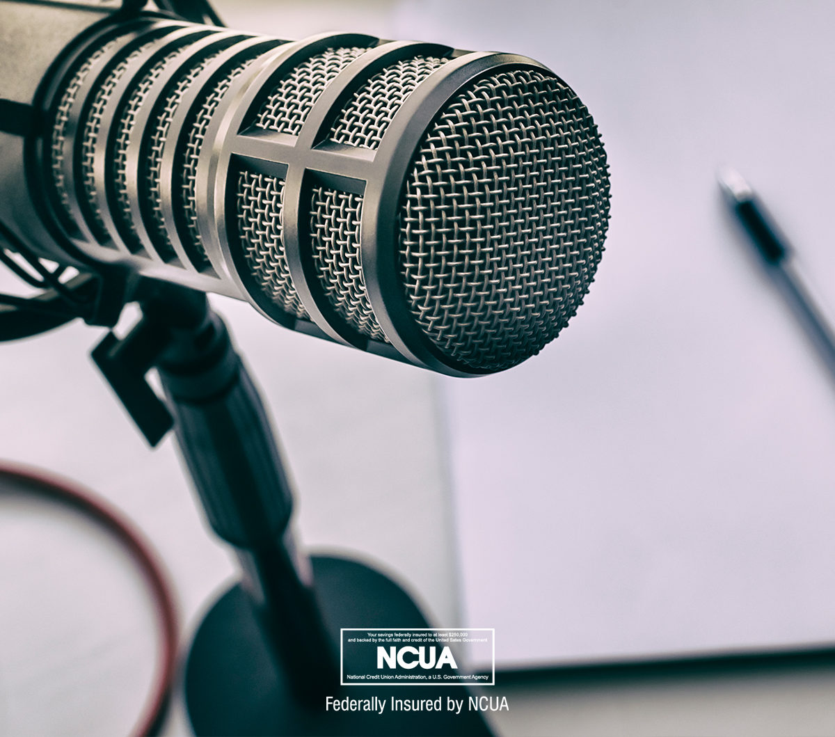 A microphone represents the Georgia Heritage Federal Credit Union Podcast.