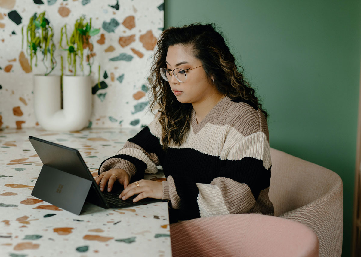 A young woman is using her laptop
