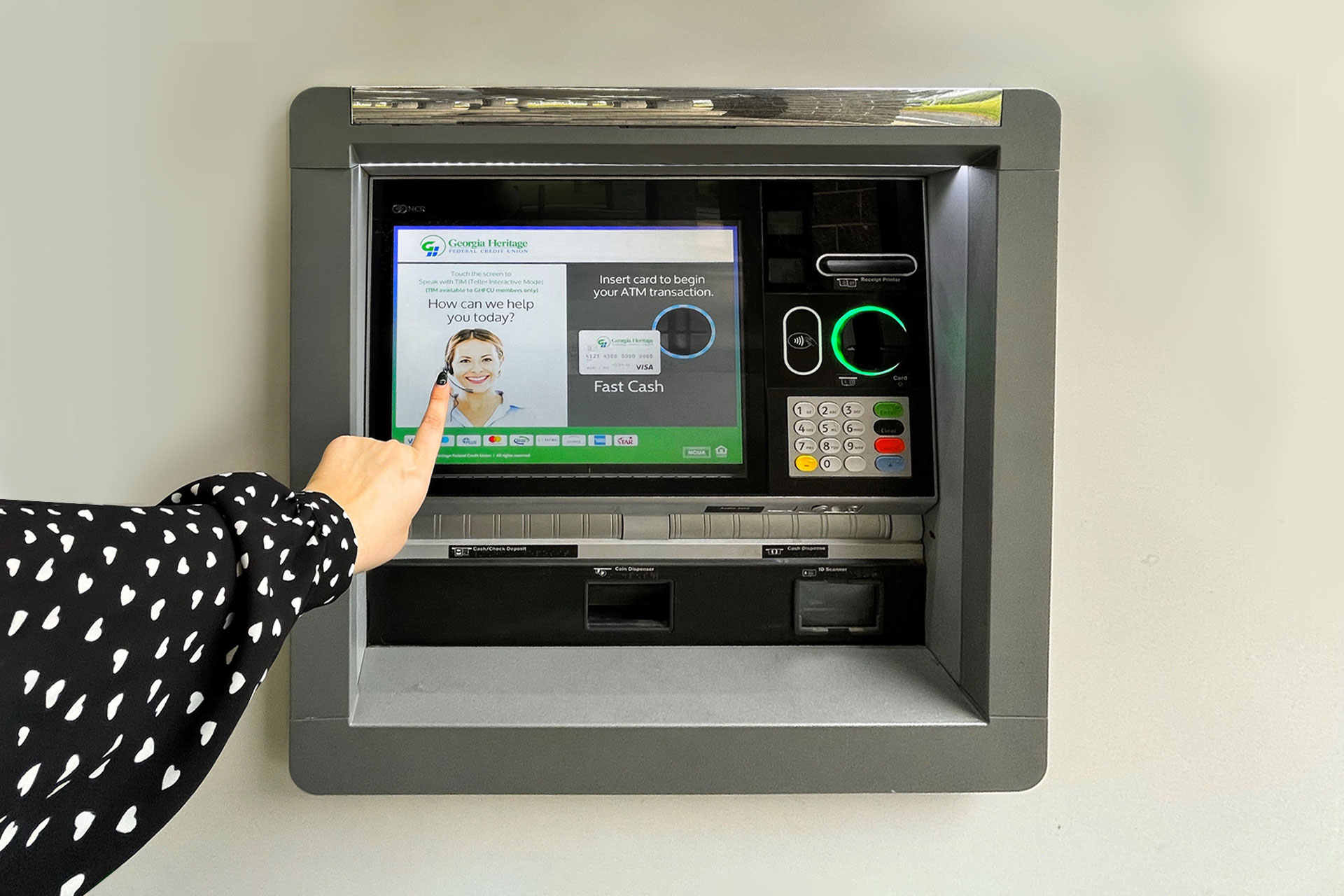 Woman using ATM with Teller Interactive Mode (TIM)